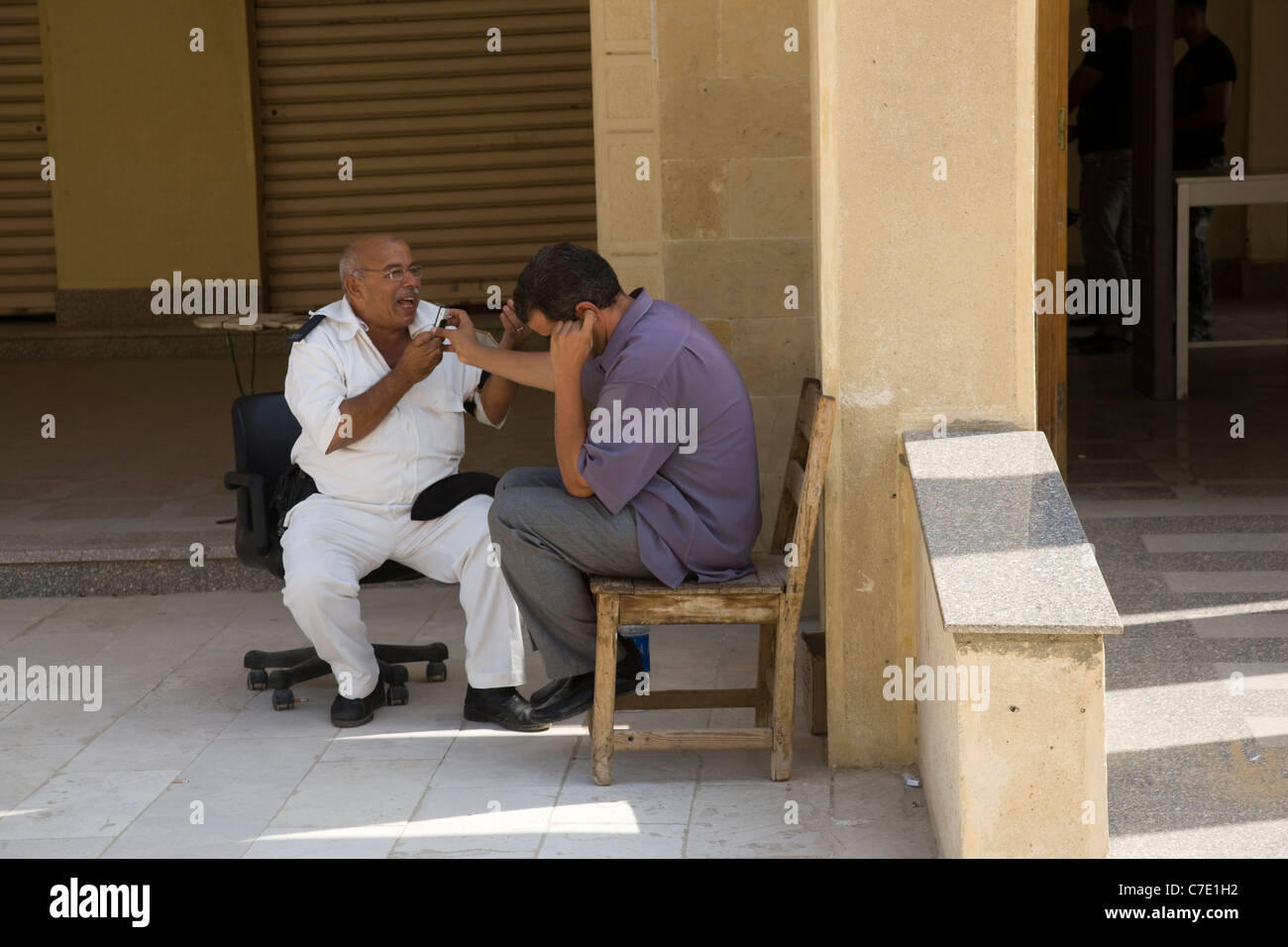 A shared telephone call, Cairo, Egypt Stock Photo