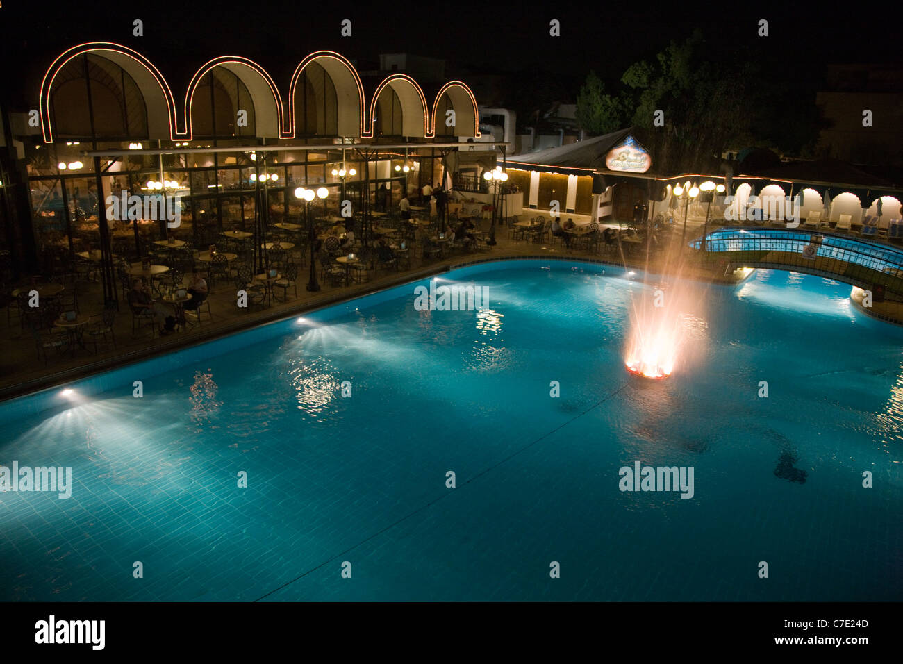 The swimming pool at the Oasis Hotel at night, Cairo, Egypt Stock Photo