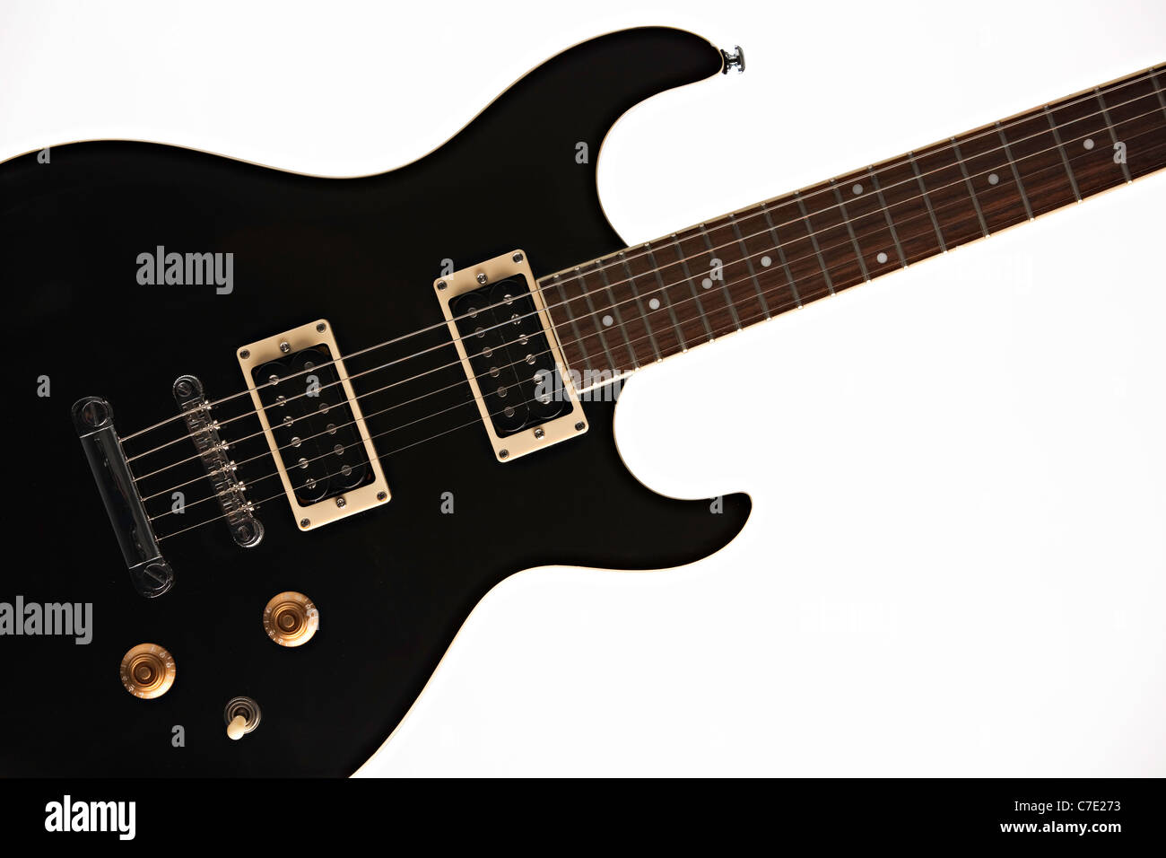 A black electric guitar isolated against a white background Stock Photo ...