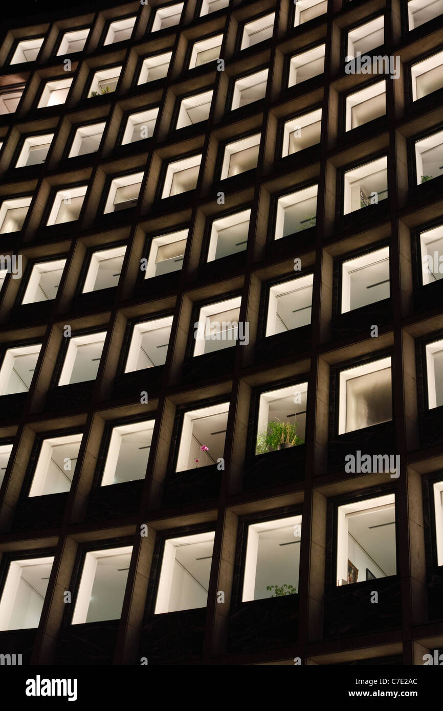 Illuminated windows of an office building at night, Berlin, Germany Stock Photo