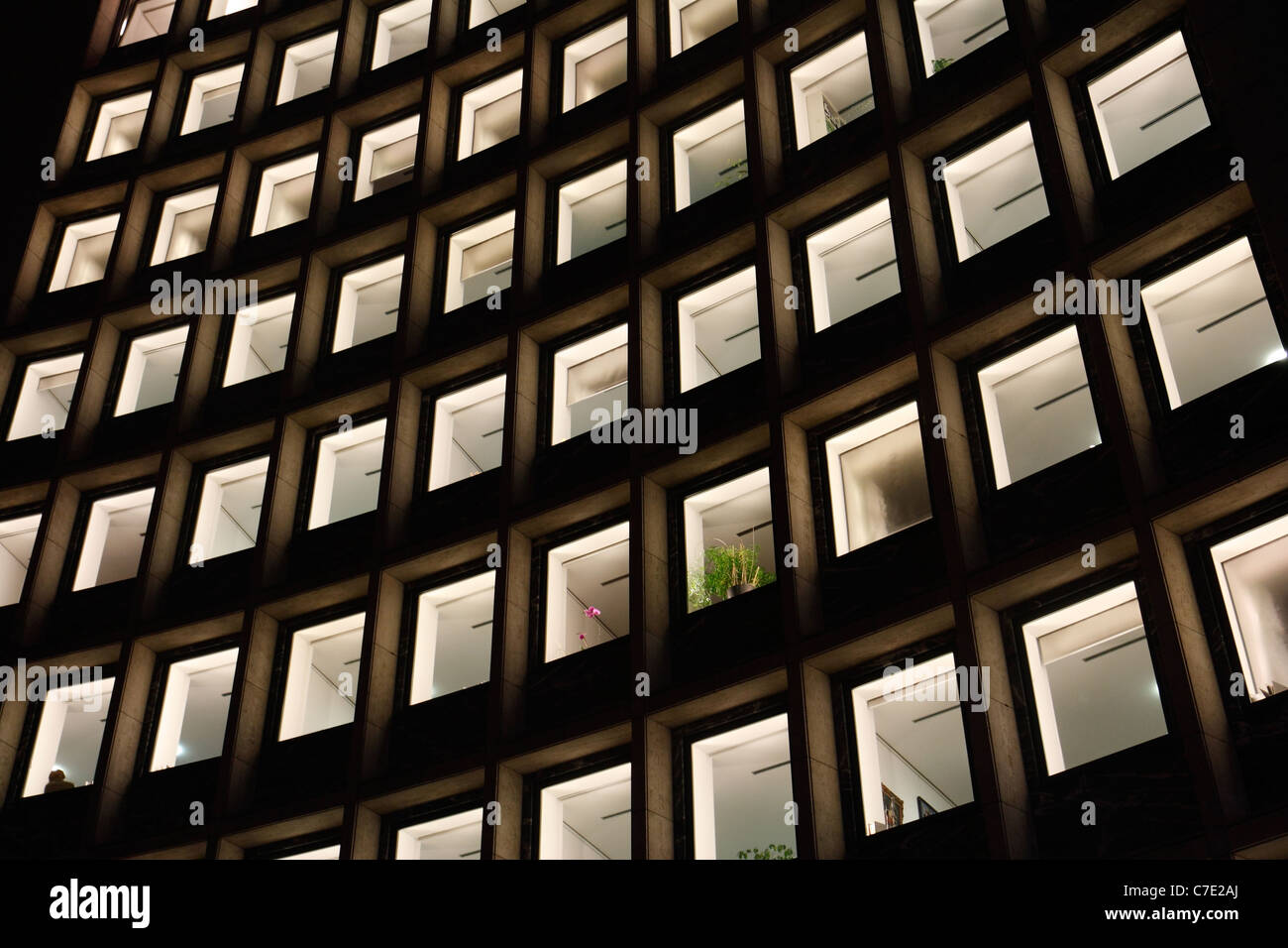 Illuminated windows of an office building at night, Berlin, Germany Stock Photo