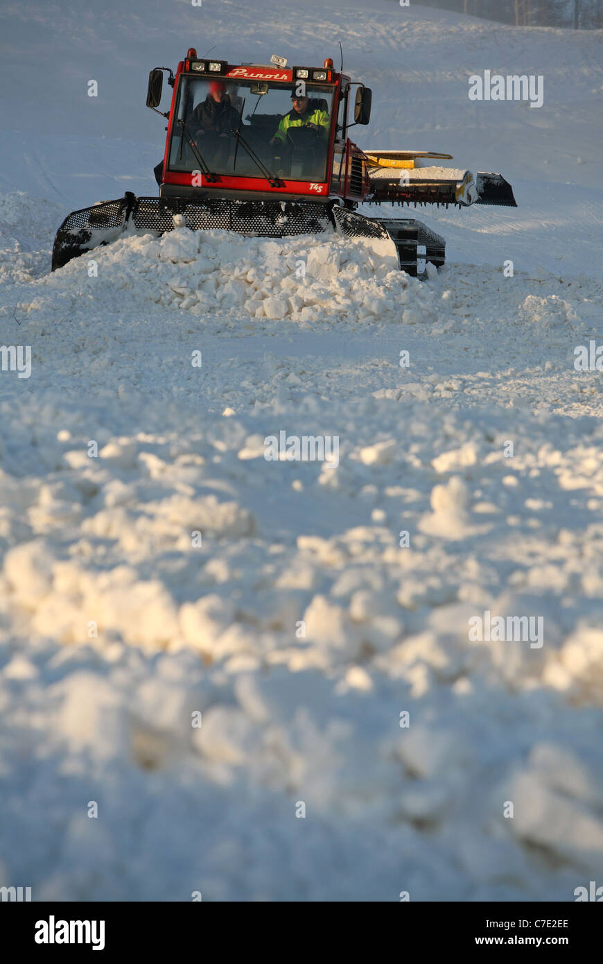 Snow crawler preparing a ski slope, Ingatorp, Sweden Stock Photo