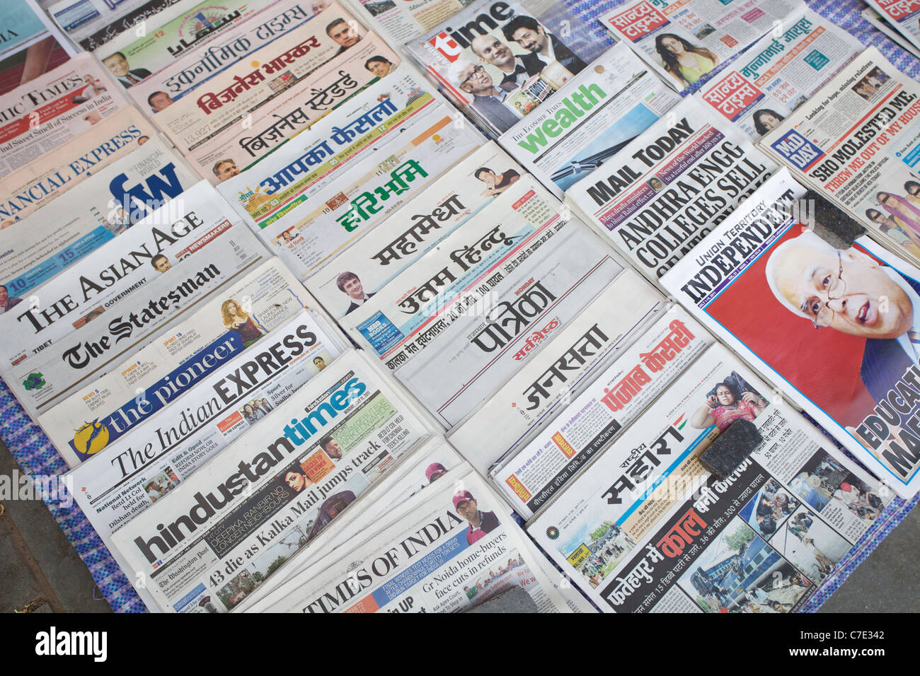 Selection of newspapers on sale on the street in Delhi, India. Stock Photo