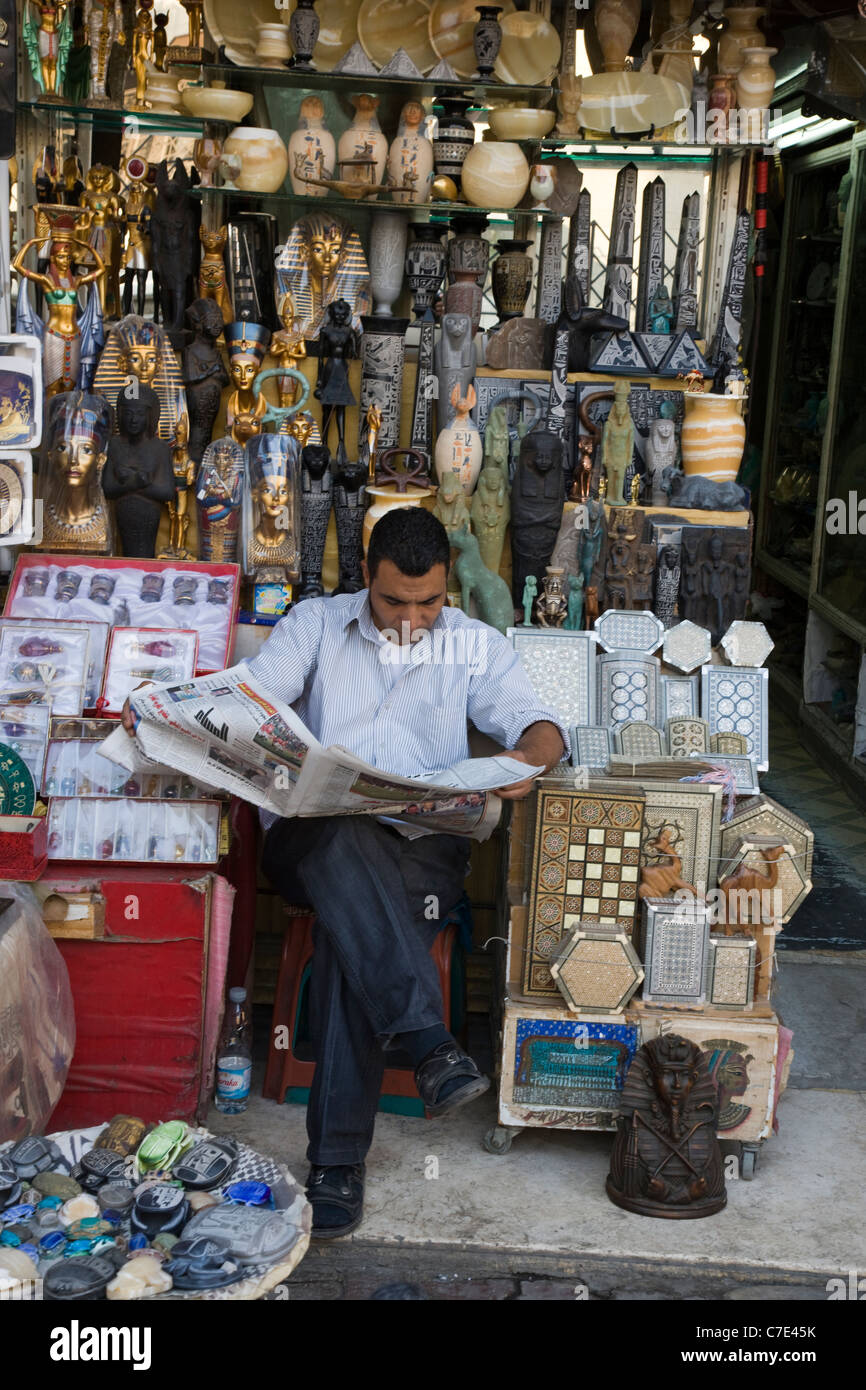 Shopkeeper reading the newspaper, Cairo, Egypt Stock Photo