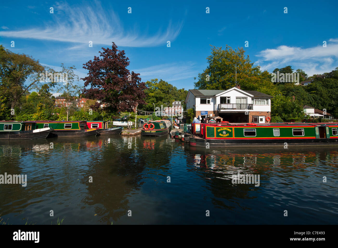 Canal Narrow Boats Narrowboats Moored By The Boathouse On The River Wey Guildford Surrey England UK Stock Photo