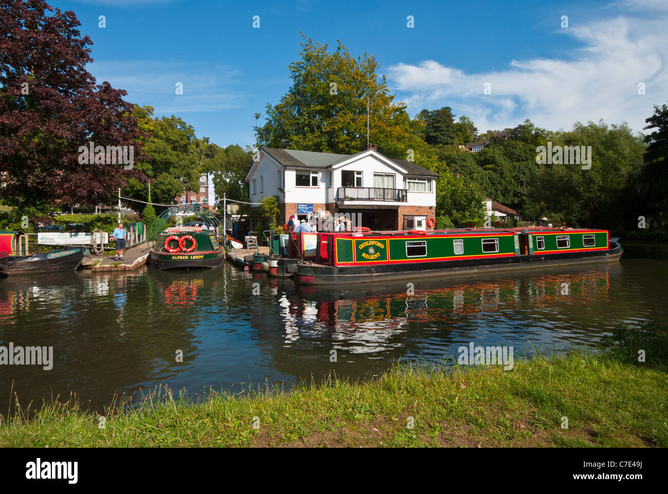 Canal Narrow Boats Narrowboats Moored By The Boathouse On The River Wey Guildford Surrey England UK Stock Photo