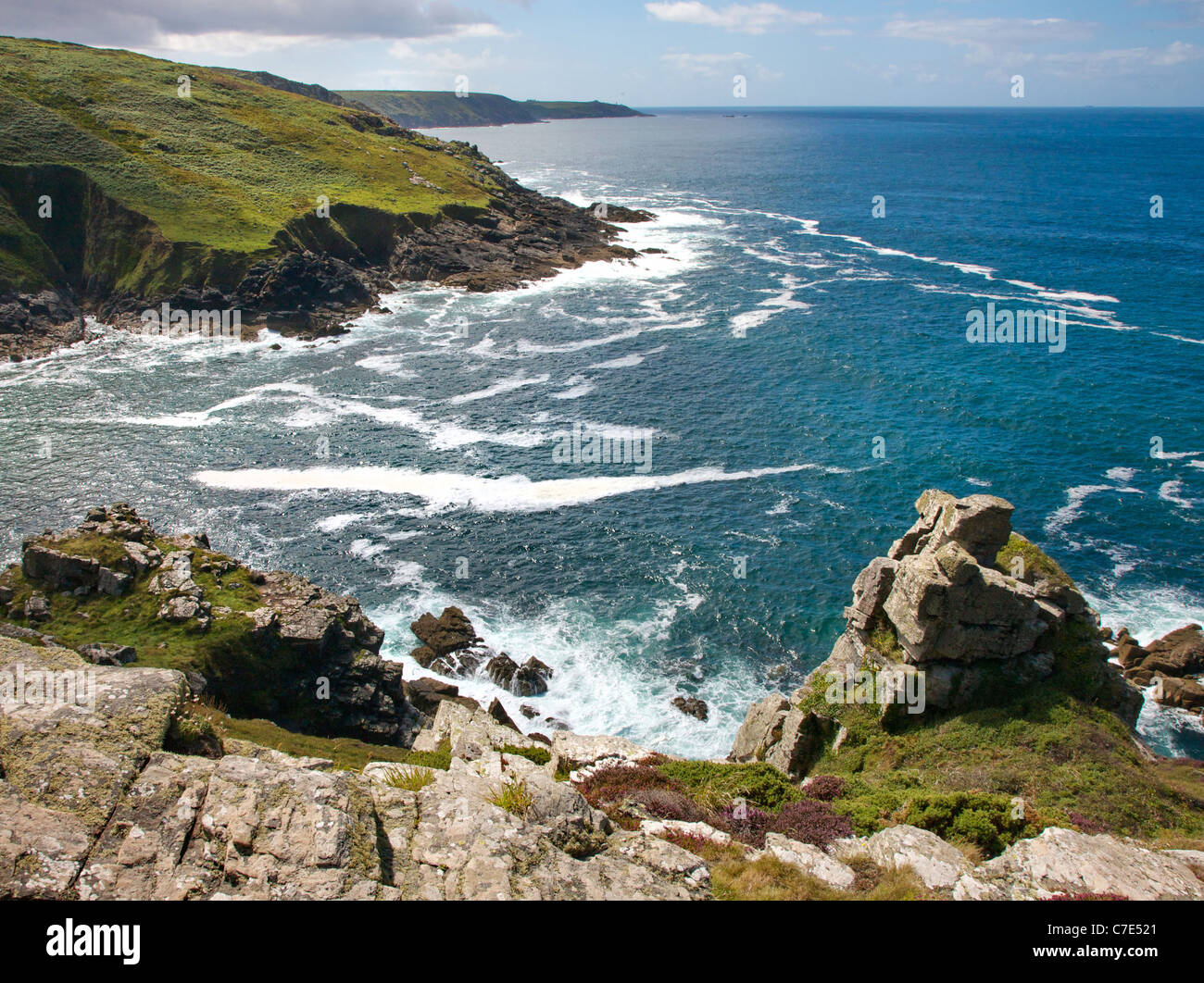 Section of the South West coast path looking across Porthmeor cove near Zennor in West Penwith Cornwall towards Pendeen Watch Stock Photo