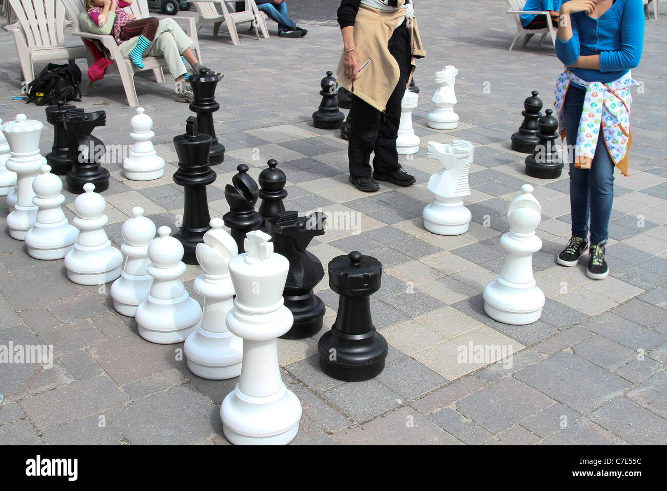 Small Female Figure Surrounded By Huge Chess Pieces Within An Ornate Old  Building Stock Photo - Download Image Now - iStock