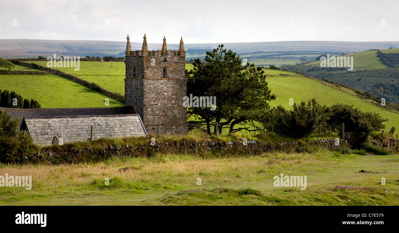 The little church of St John the Baptist shelters behind Foreland point high on Exmoor  in Devon UK Stock Photo