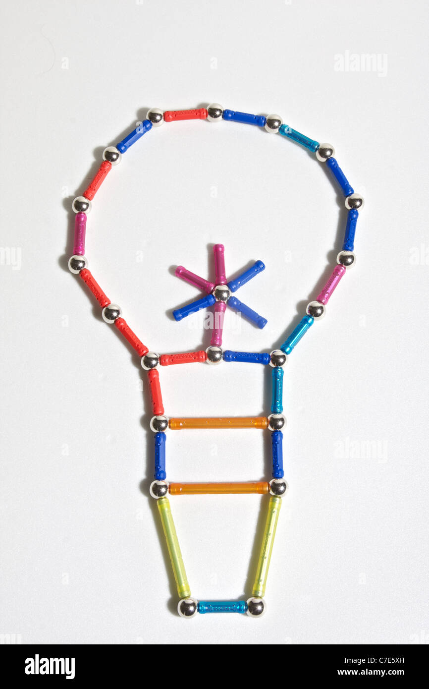 constructed ecological light bulb with colored toys, energy electricity Stock Photo