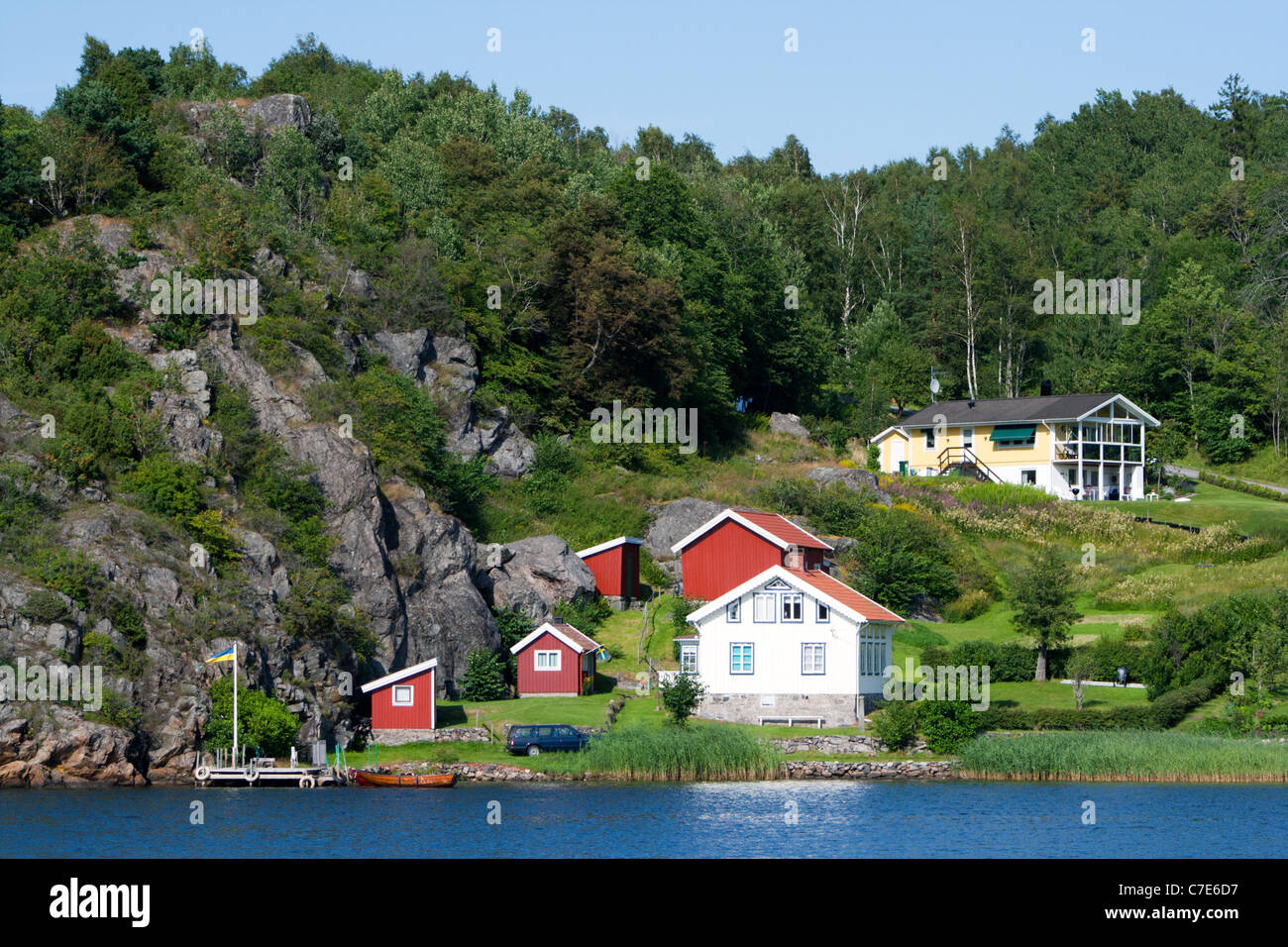 Houses on a lake in Sweden. Stock Photo