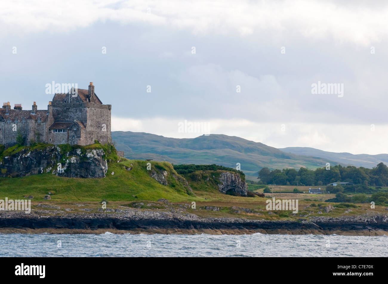 The sun breaking through over Duart Castle on the Isle of Mull Stock Photo
