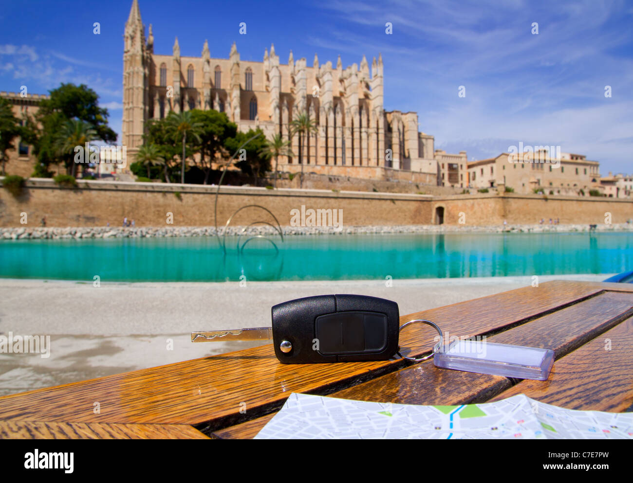 Car rental keys on wood table with city tourist map in Palma de