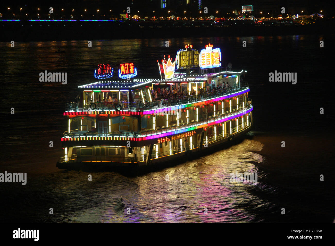 Night scene of a well lit dinner cruise boat on the Yangtze River at Chongqing, China Stock Photo