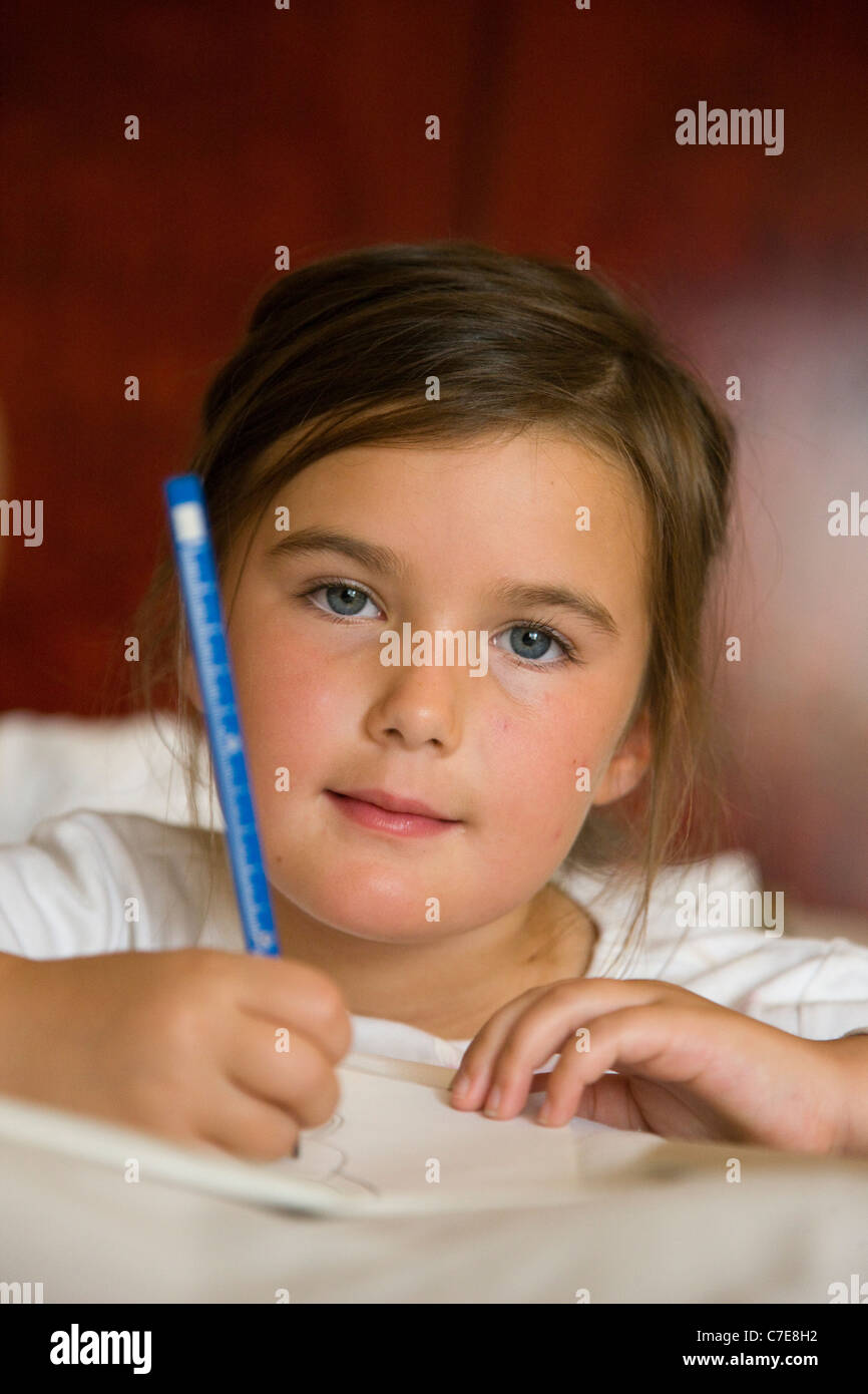 Young girl tourist writing her diary in the hotel room, Cairo, Egypt Stock Photo