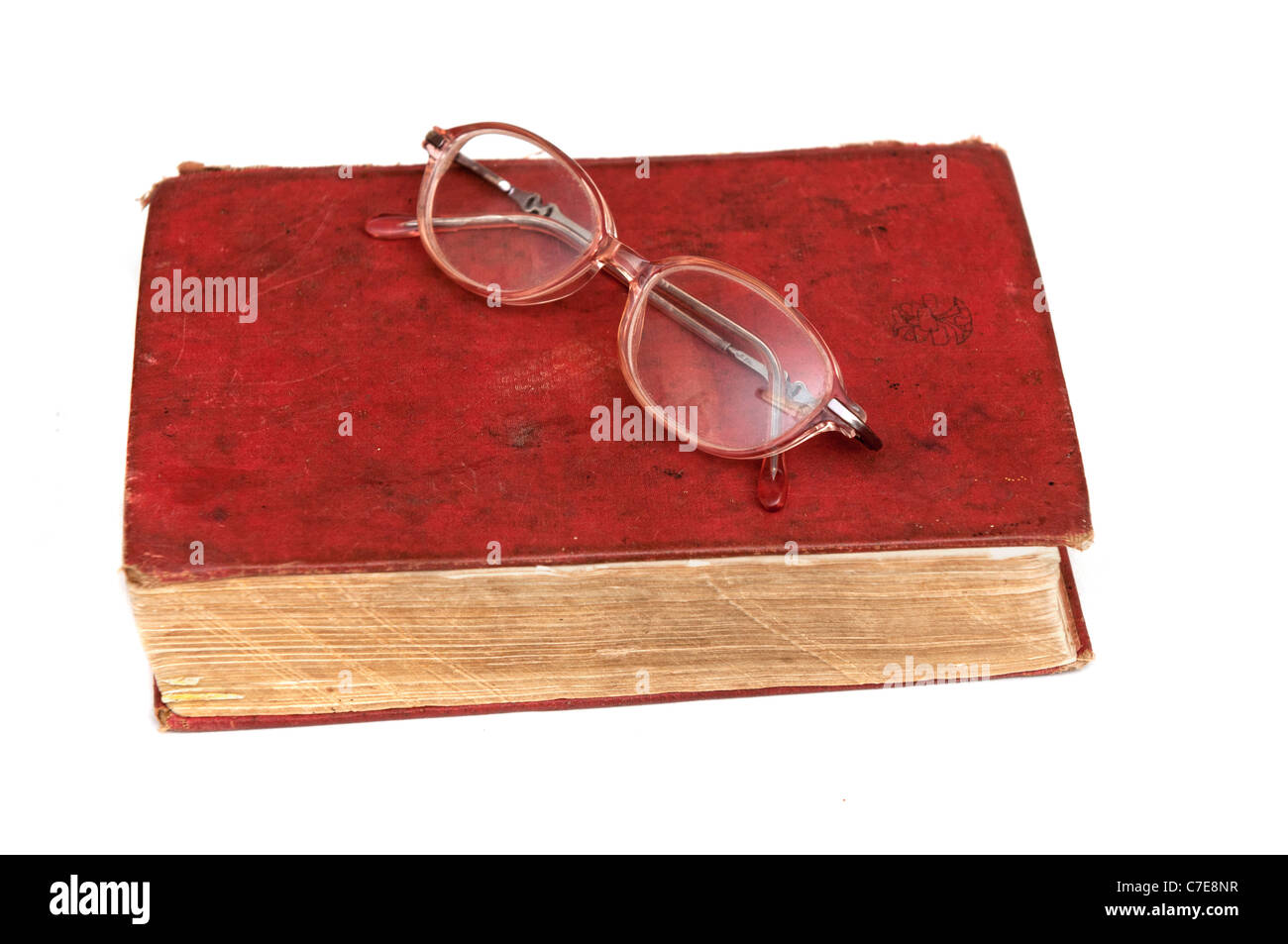 dictionary and a pair of glasses isolated on a white background Stock Photo