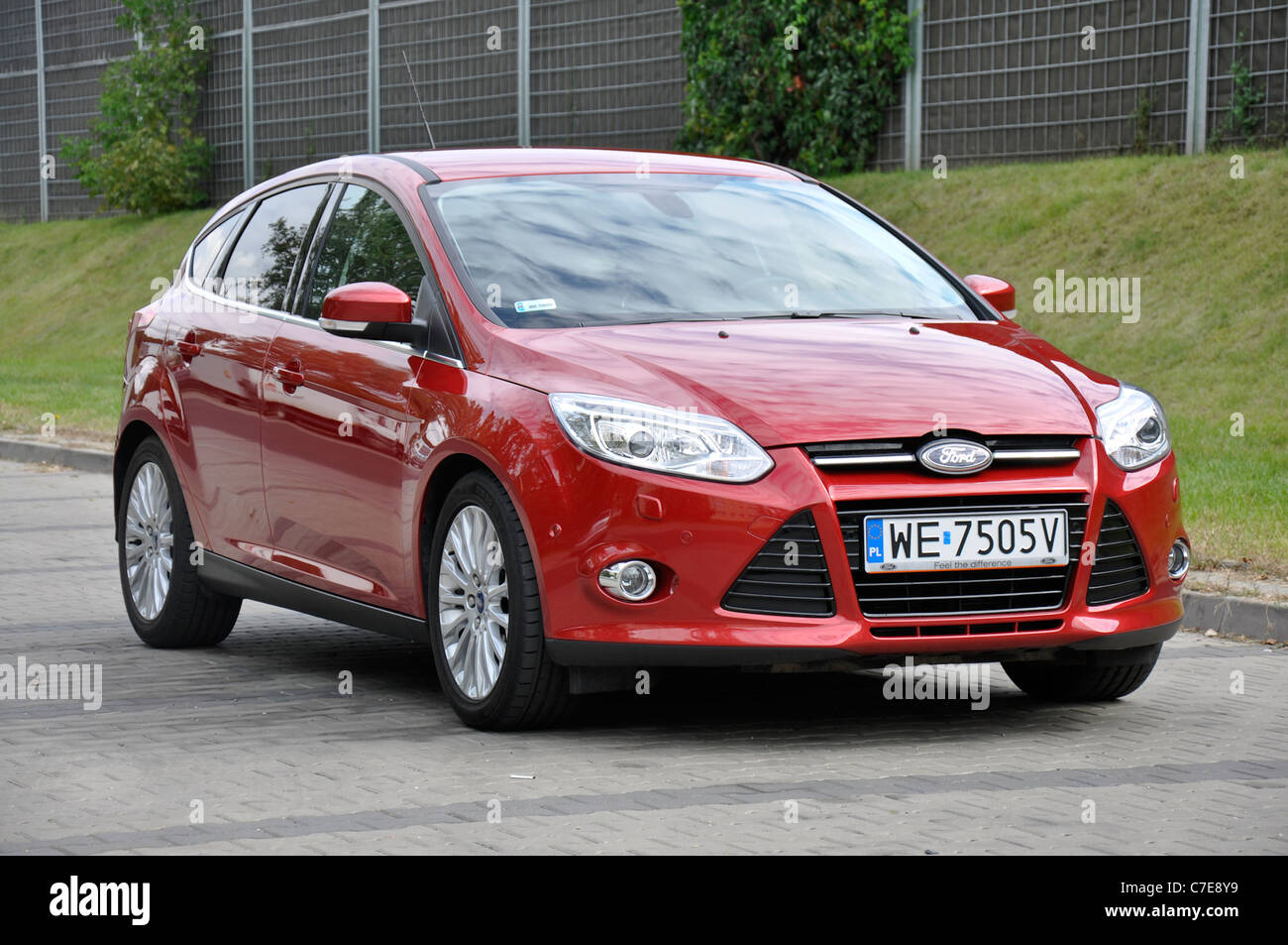 Ford Focus III 1.6 TDCi - MY 2011 - red - Popular German compact car,  segment C - on parking Stock Photo - Alamy