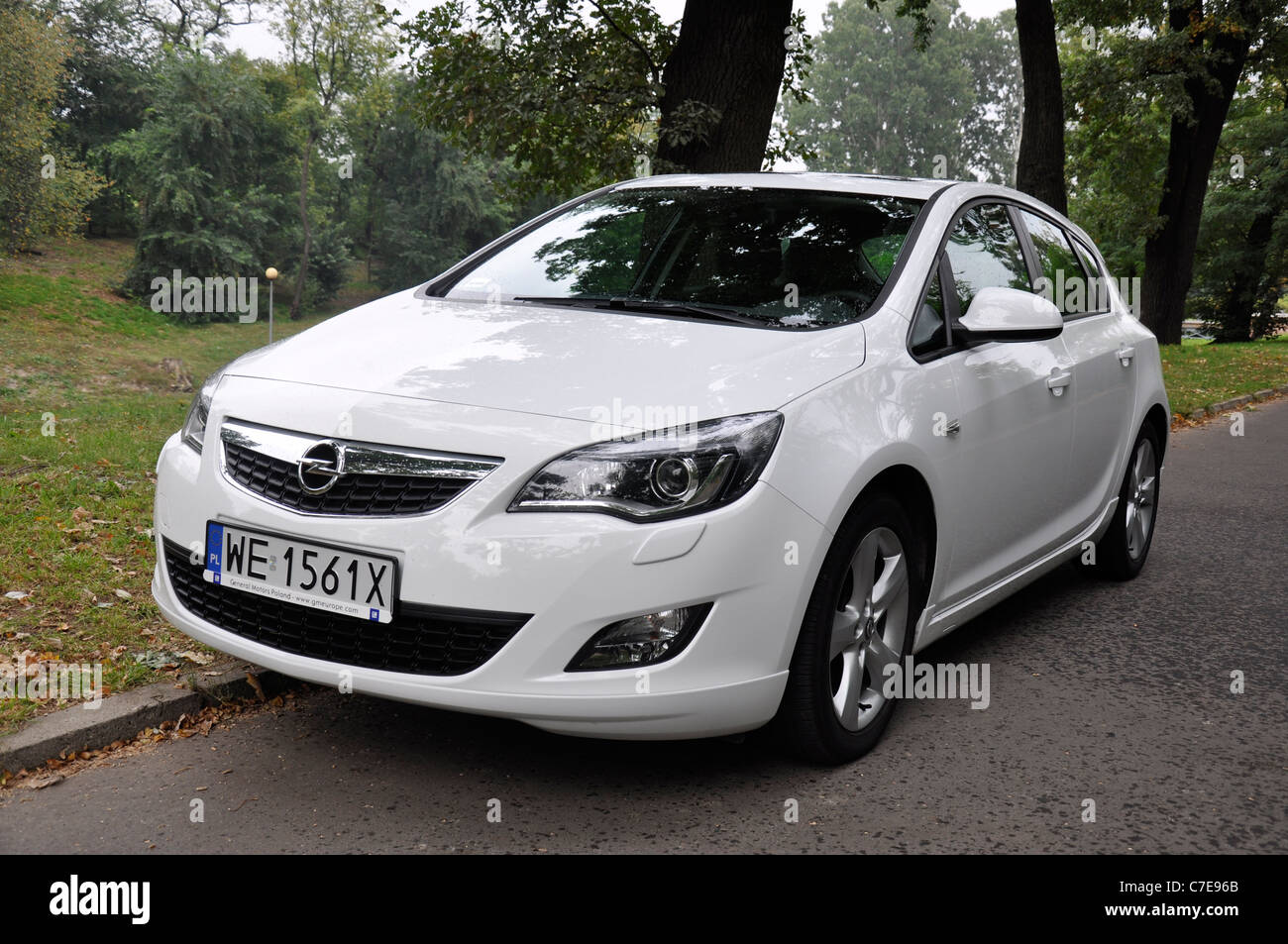 Opel Astra IV 1.4 Turbo - MY 2009 - white - German compact car, segment C - in a park Stock Photo