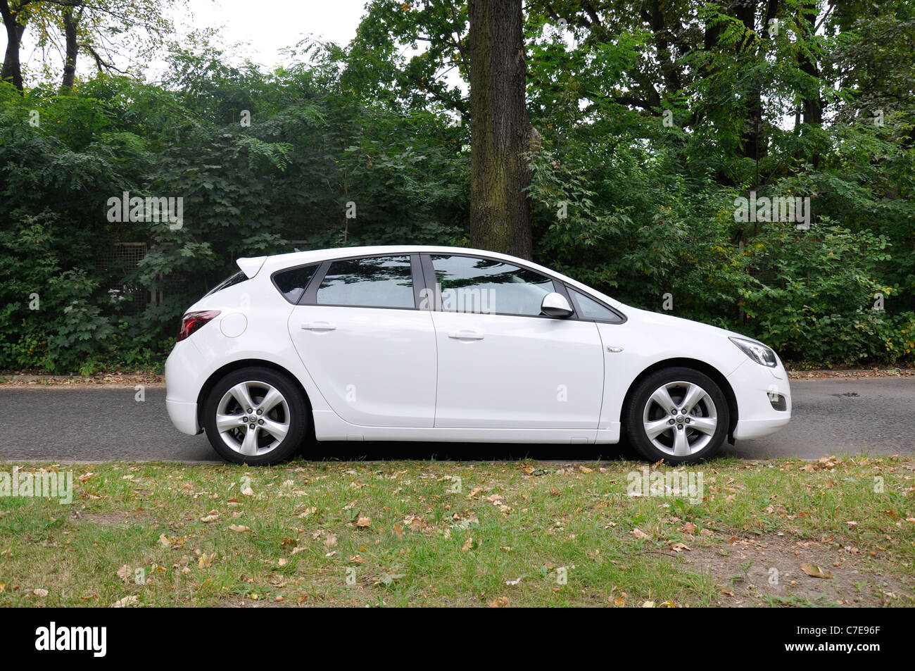 Opel Astra IV 1.4 Turbo - MY 2009 - white - German compact car, segment C - in a park Stock Photo