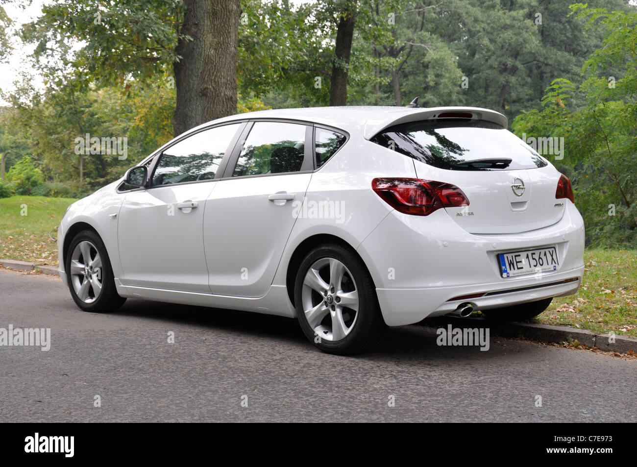 Opel Astra IV 1.4 Turbo - MY 2009 - white - German compact car, segment C - in a park Stock Photo