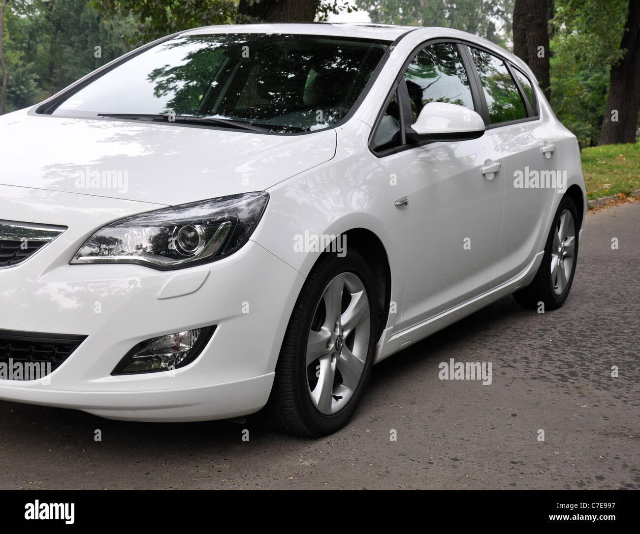 Opel Astra IV 1.4 Turbo - MY 2009 - white - German compact car, segment C - in a park Stock Photo