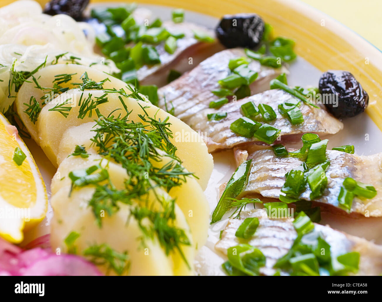 Salted herring slice with boiled potato Stock Photo