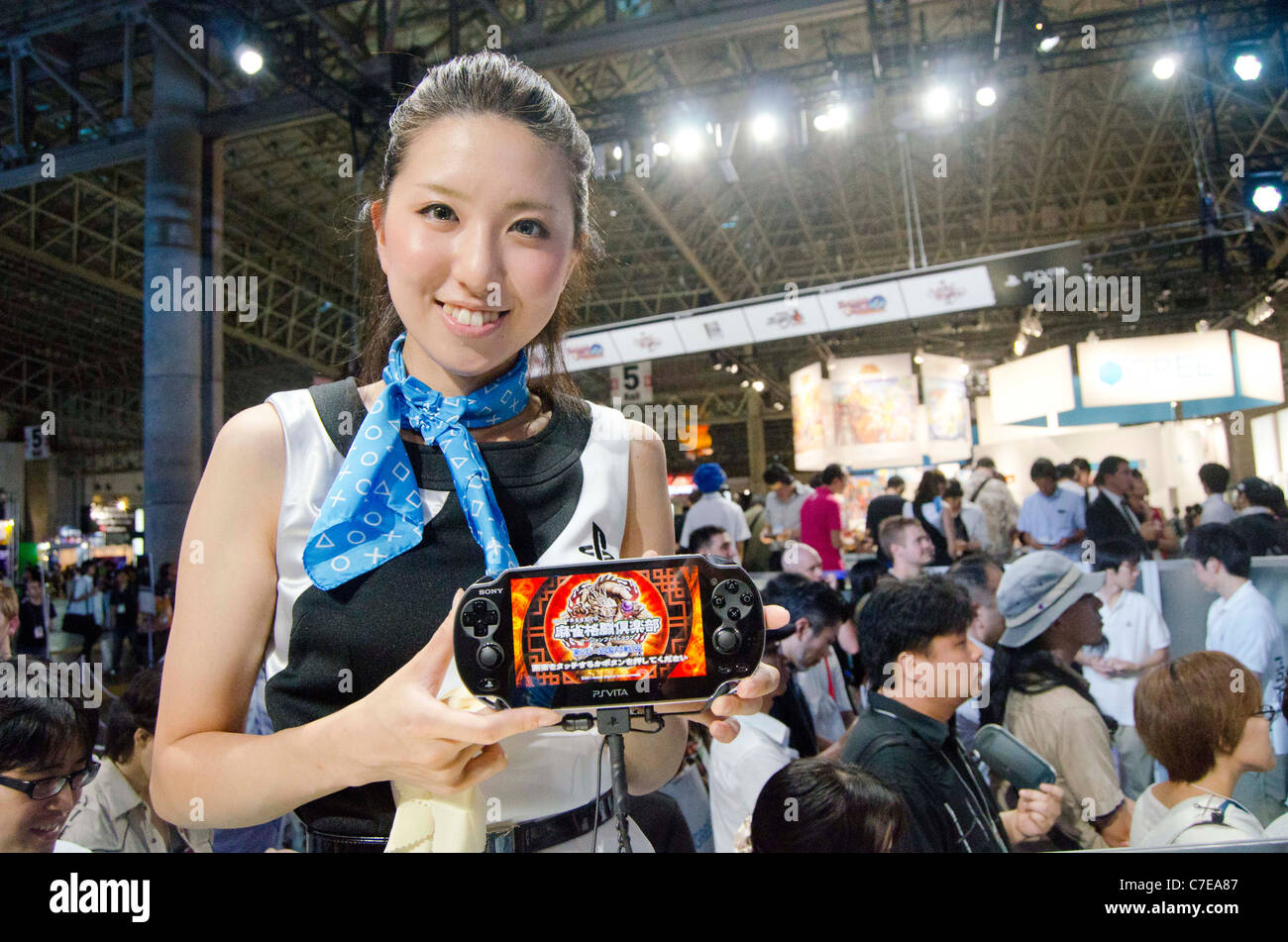 Sony's campaign girl poses for pictures with the PlayStation Vita during the Tokyo Game Show 2011. Stock Photo