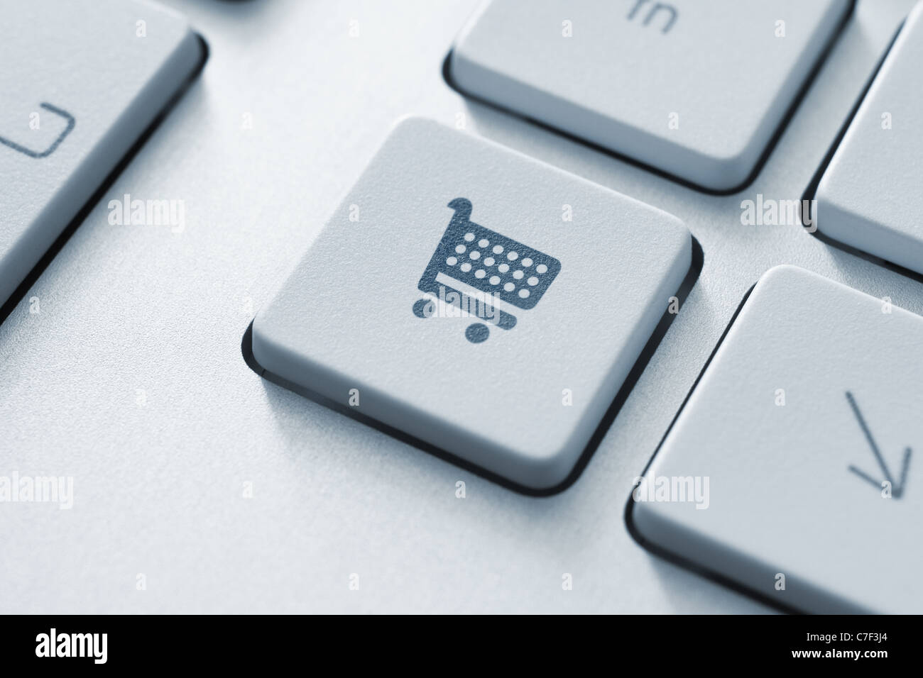 Shopping cart icon on keyboard key. Toned Image Stock Photo Alamy