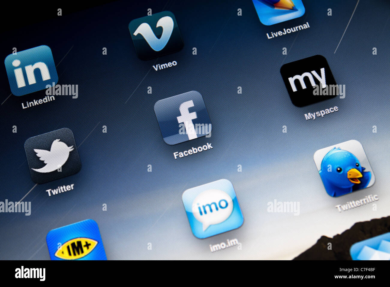 Apple iPad 2 screen showing social apps, including Facebook, Myspace, Twitter, LinkedIn, Vimeo, LiveJournal and Twitter. Stock Photo