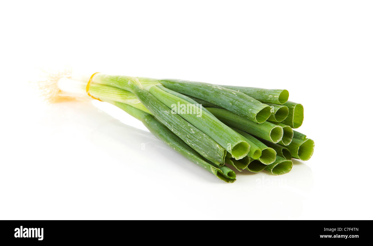bunch of fresh spring onions over white background Stock Photo - Alamy