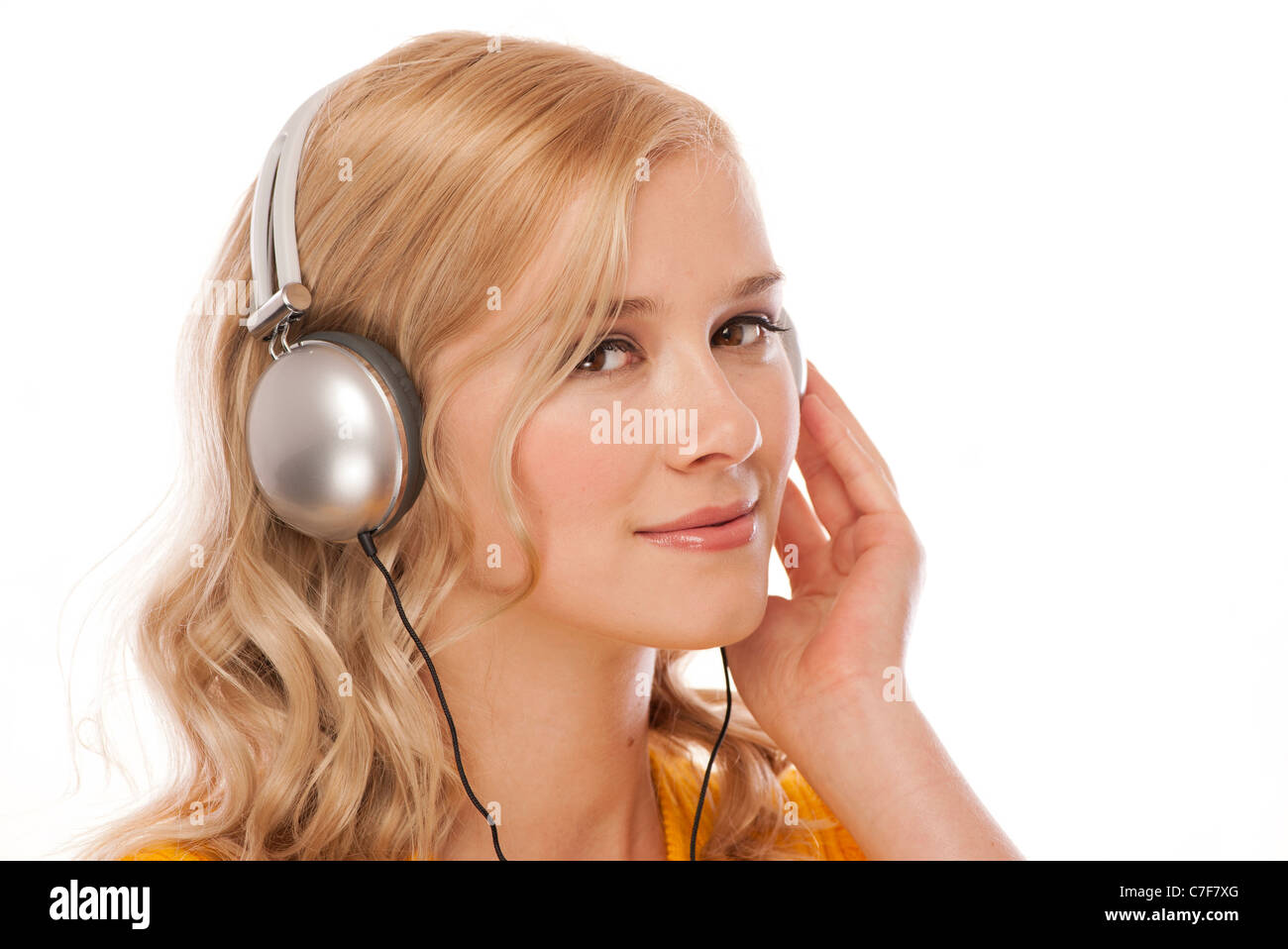 woman wearing headphones listening to music Stock Photo - Alamy