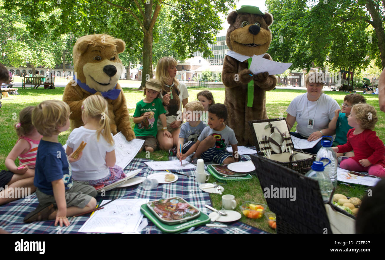Yogi Bear, Boo Boo and wild life presenter Michaela Strachan having a