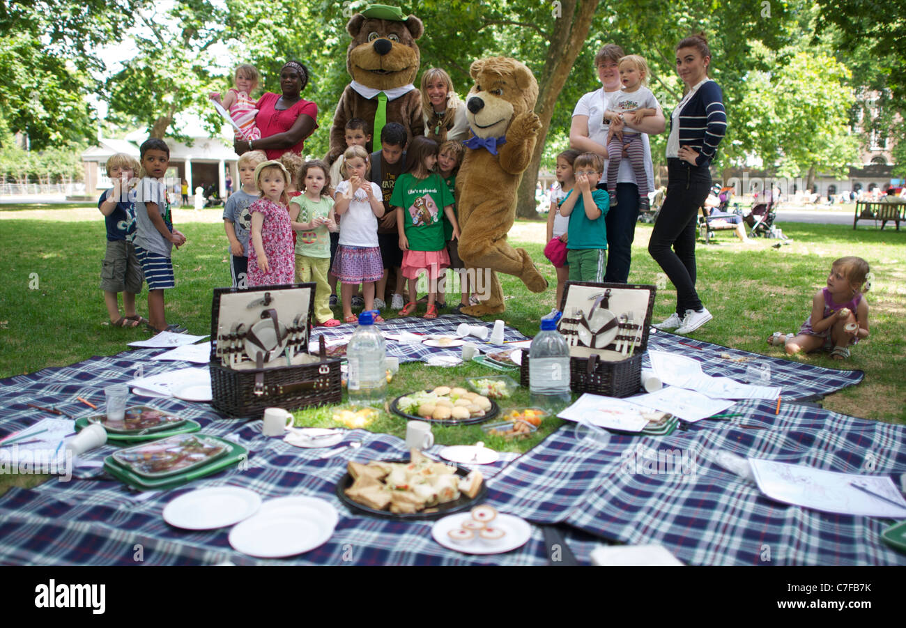 Yogi Bear, Boo Boo and wild life presenter Michaela Strachan having a