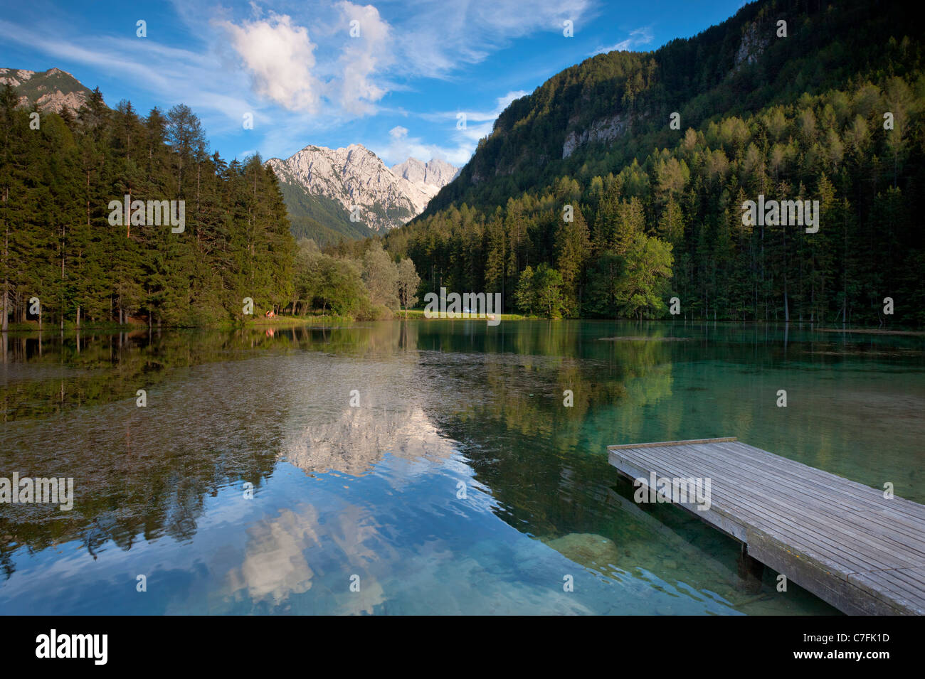 Alpine Lake at Jezersko, Slovenia: Plansarsko Jezero, with the Kamnik Alps  visible in the distance Stock Photo - Alamy