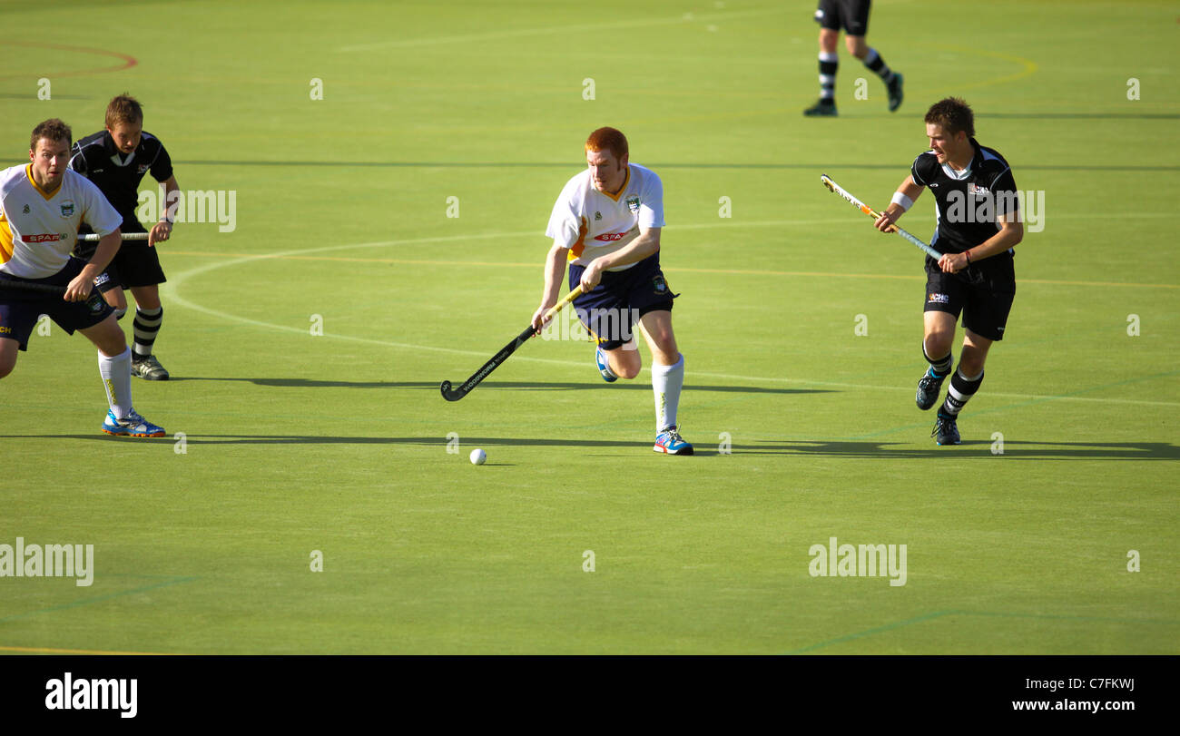 Male hockey players in action on an astro turf pitch Stock Photo Alamy