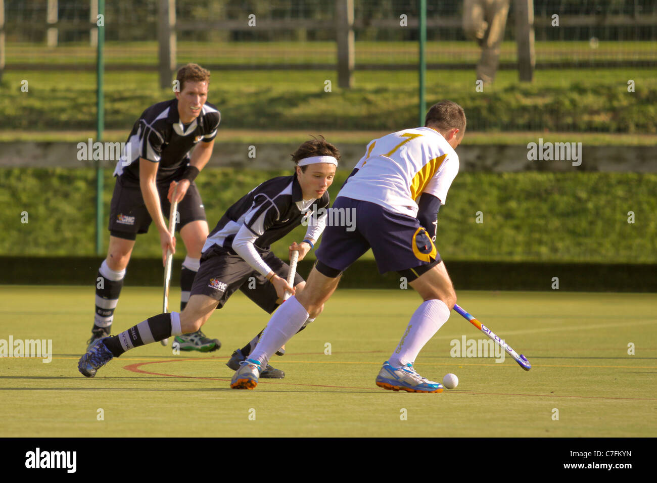 Male hockey players in action on an astro turf pitch Stock Photo Alamy