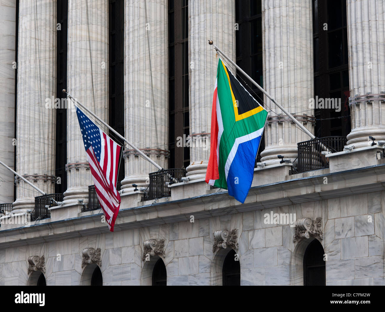American and South African flags hang in front of the New York Stock  Exchange Stock Photo - Alamy