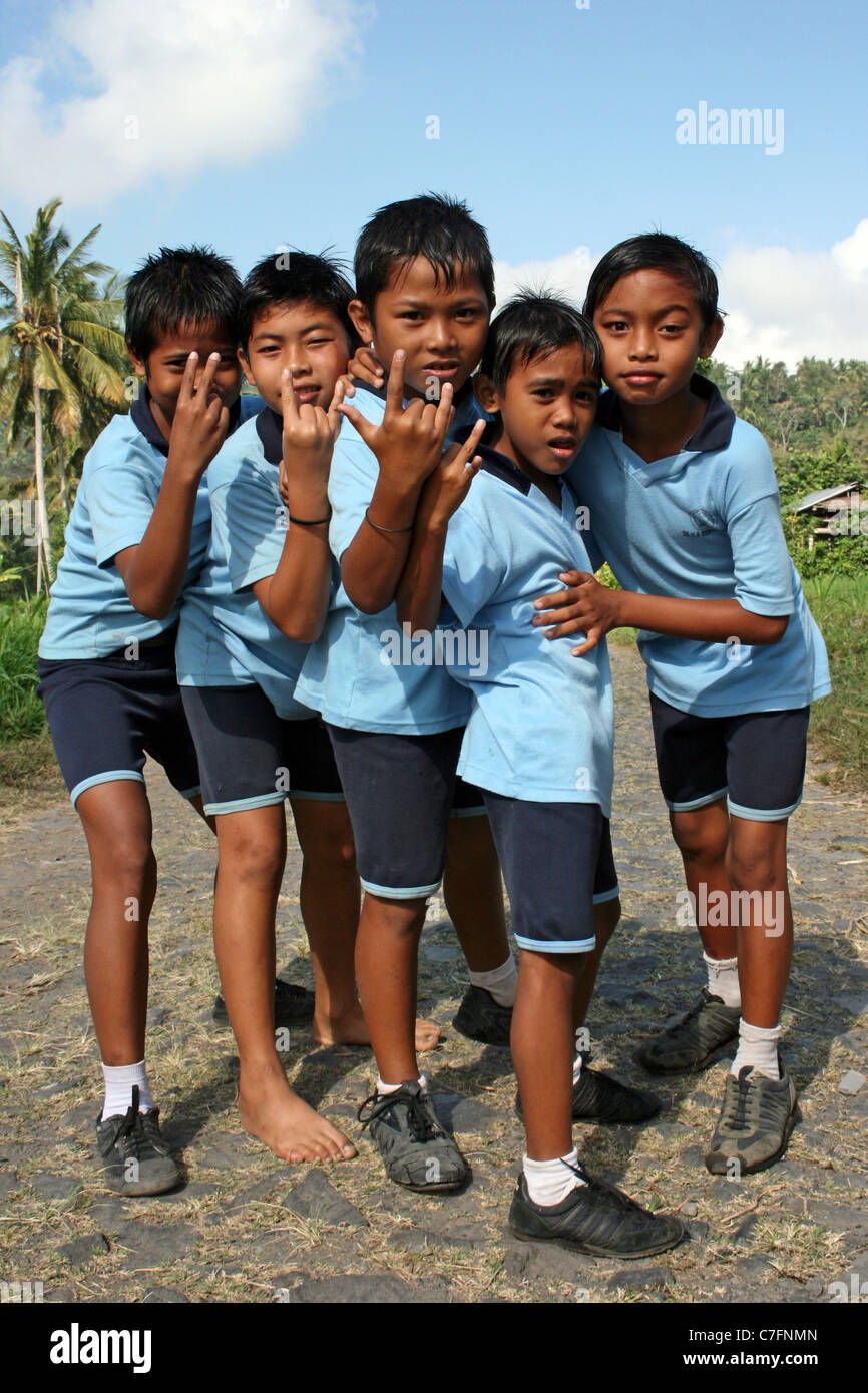 Cheeky Indonesian School Lads Doing 'Rock' Sign Stock Photo