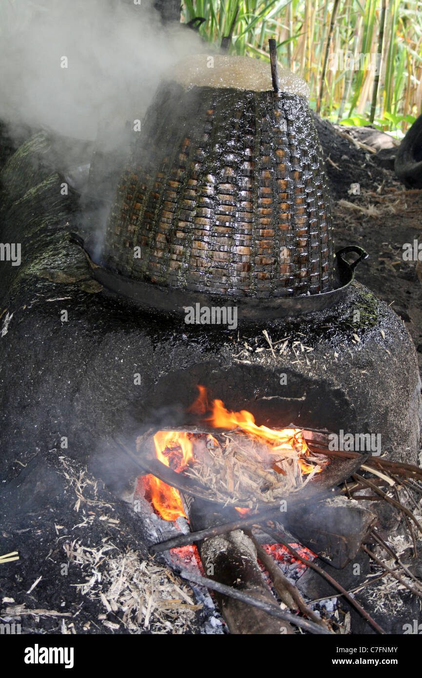 Sugar Cane Juice Bubbling In A Boiling Kettle During Village Sugar Refining Process Stock Photo