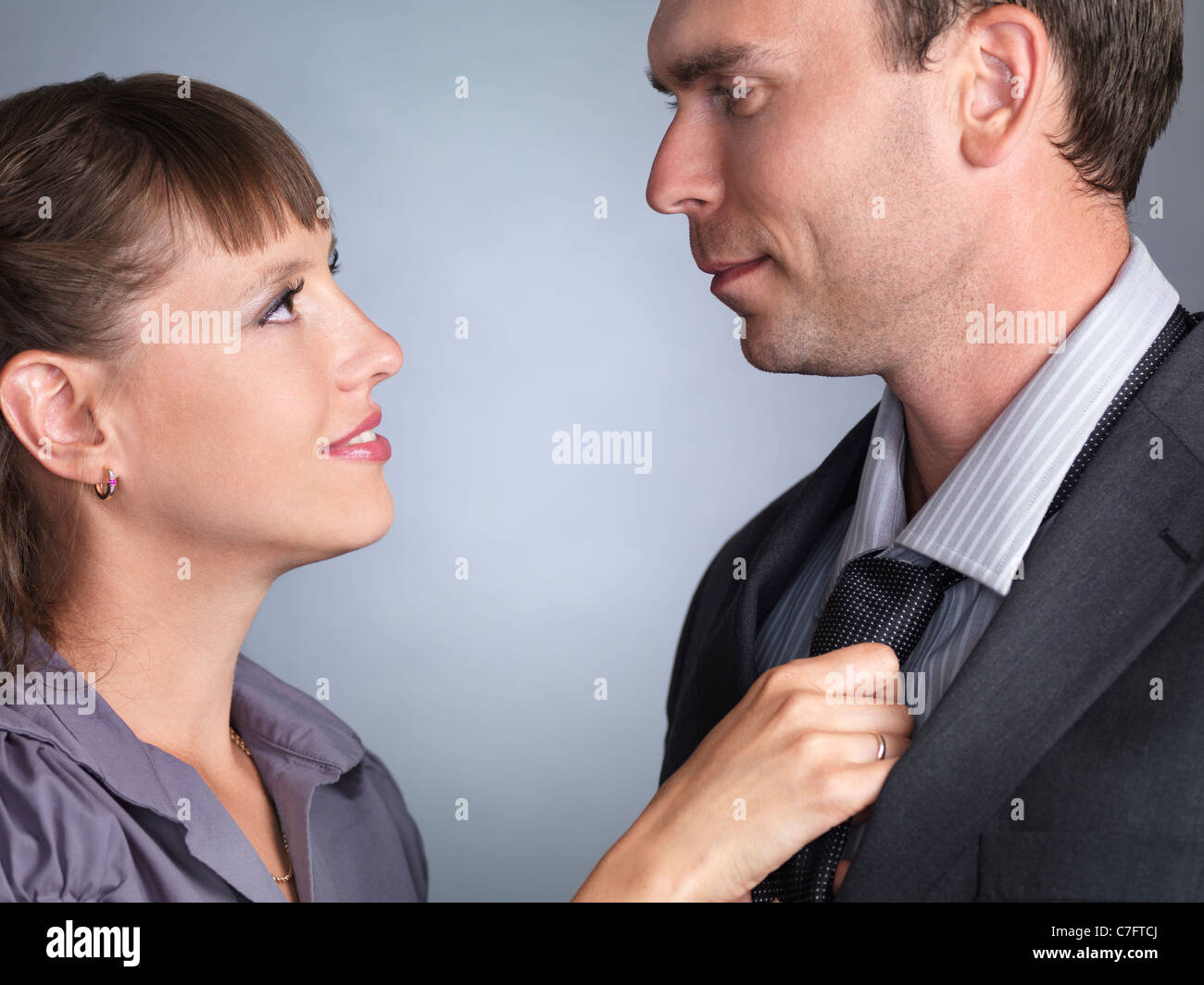 Woman tying husband's tie hi-res stock photography and images - Alamy