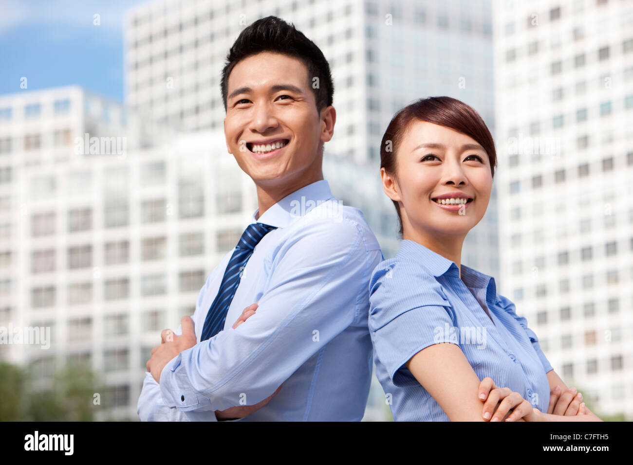Colleagues Standing Confidently Together Stock Photo - Alamy