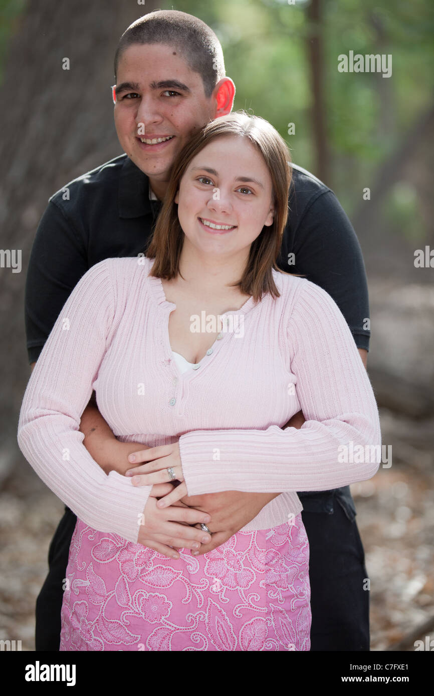 young-married-couple-on-location-in-the-woods-cheerful-and-showing-C7FXE1.jpg