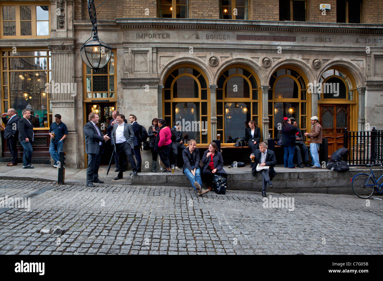 People in front of bar in London, England Stock Photo