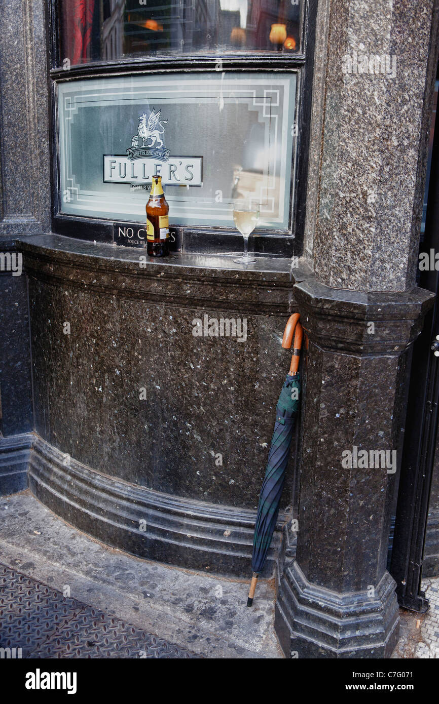Beer bottle and umbrella outside bar Stock Photo Alamy