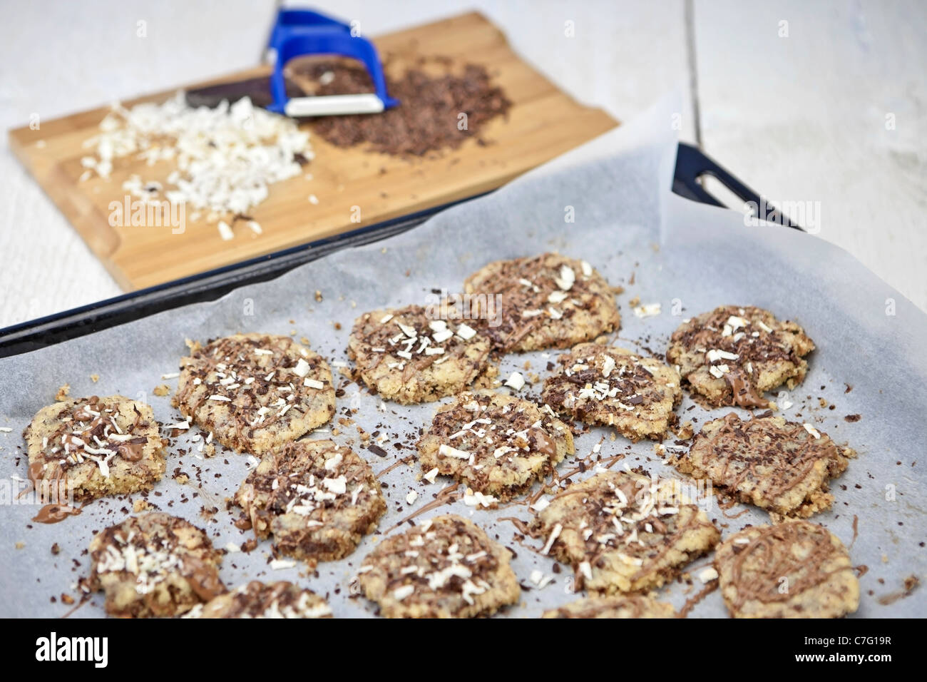 freshly baked cookies that are decorated with icing and chocolate shavings Stock Photo