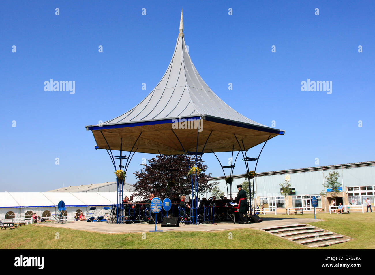 Musicians of the Light Infantry play in the bandstand at the Bath and West Showground in Somerset Stock Photo