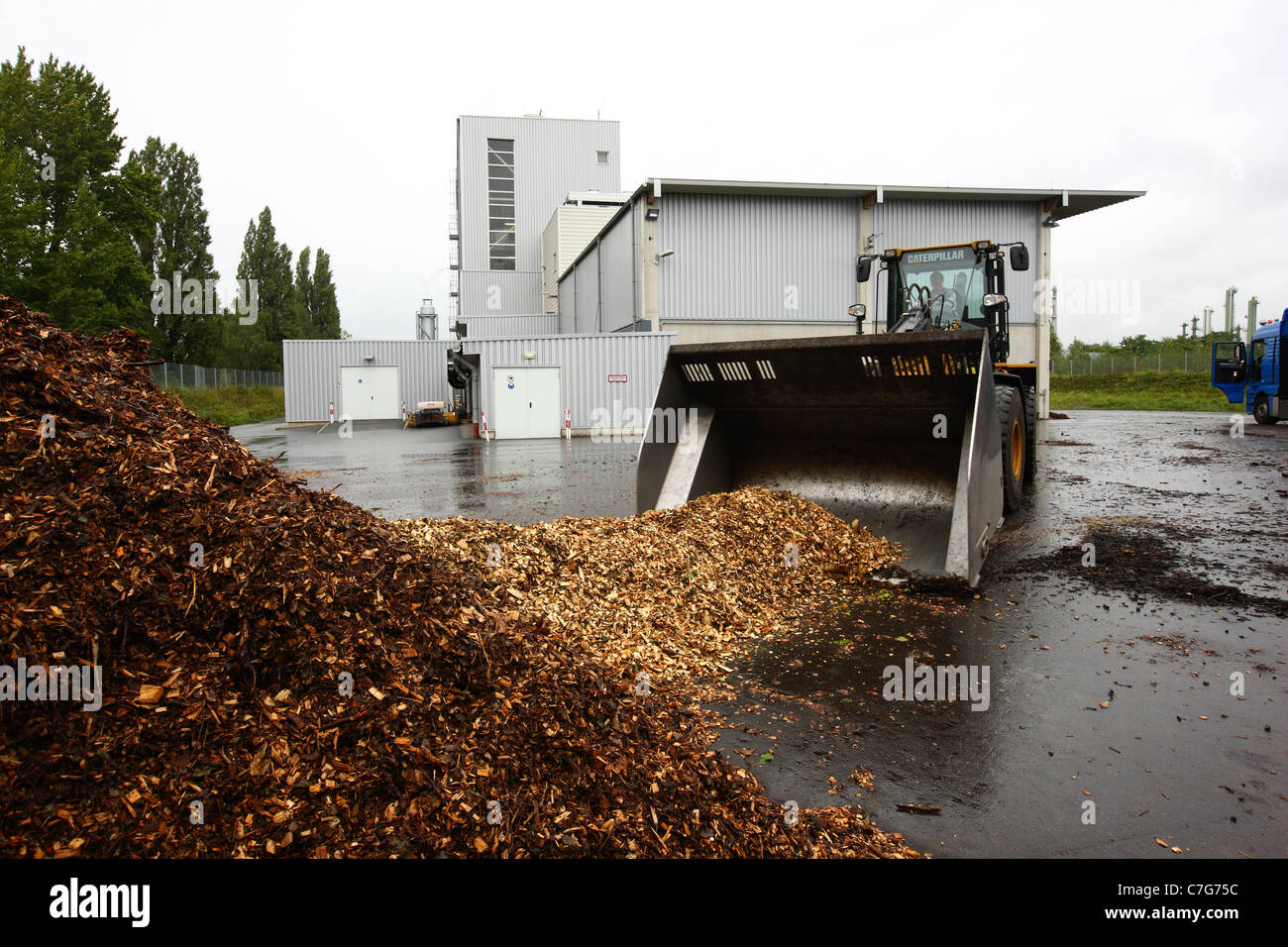 Biomass power plant. Burns waste wood to heat water, for running a steam turbine, to generate electric power. Stock Photo