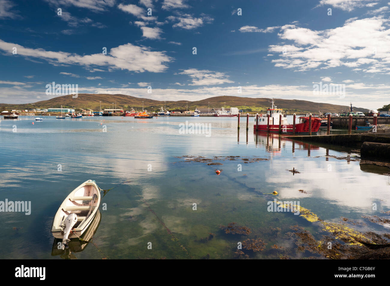 The harbour at Castletownbere, a fishing town on the Beara peninsula, west Cork, Ireland, with Bere Island in the background across Bantry Bay Stock Photo