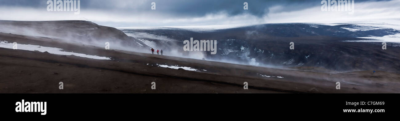 Scientist viewing steaming crater after Grimsvotn eruption, Iceland Stock Photo