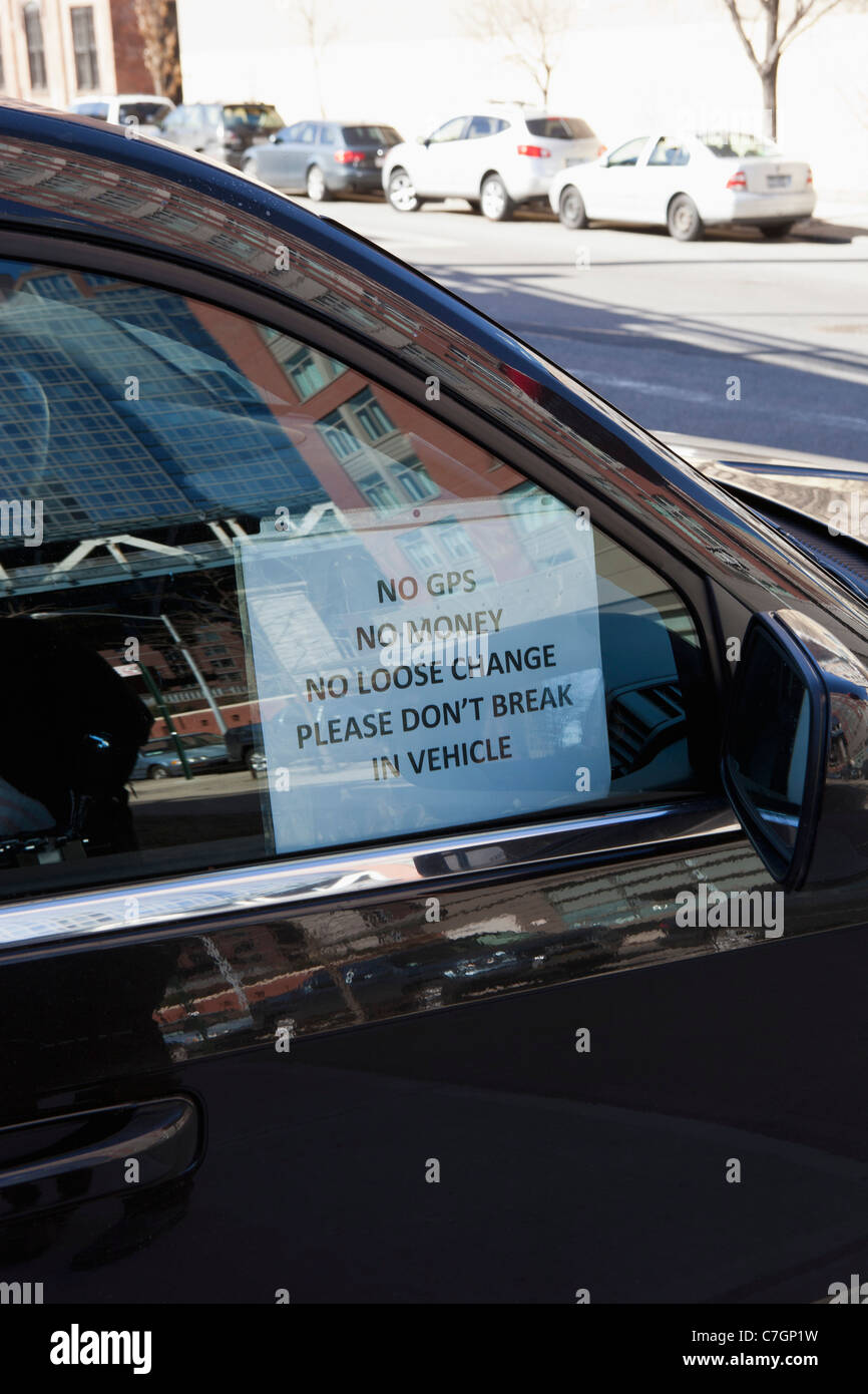 Humorous antitheft sign hanging in a car window Stock Photo Alamy